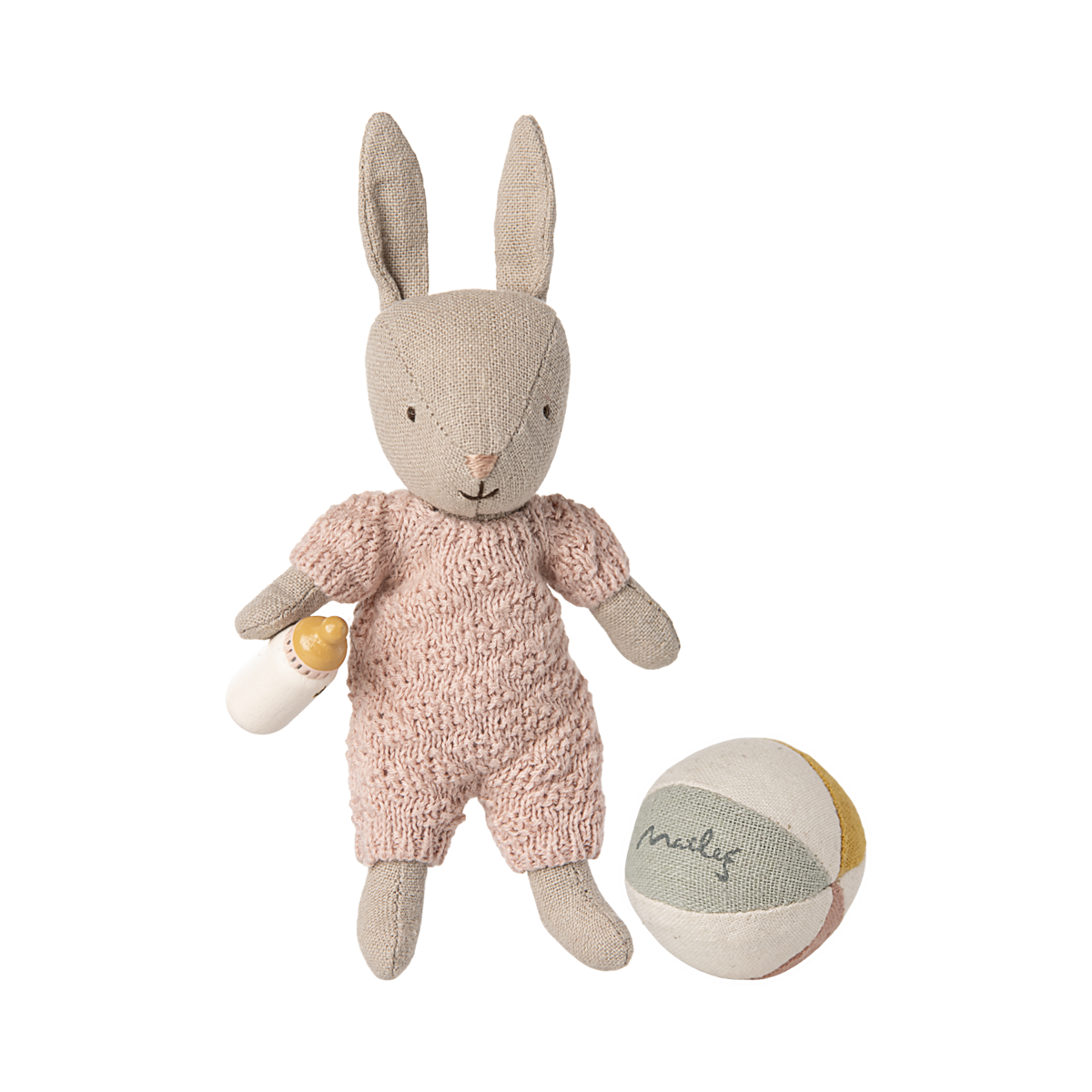 Stuffed bunny toy in a pink outfit with a ball on a white background