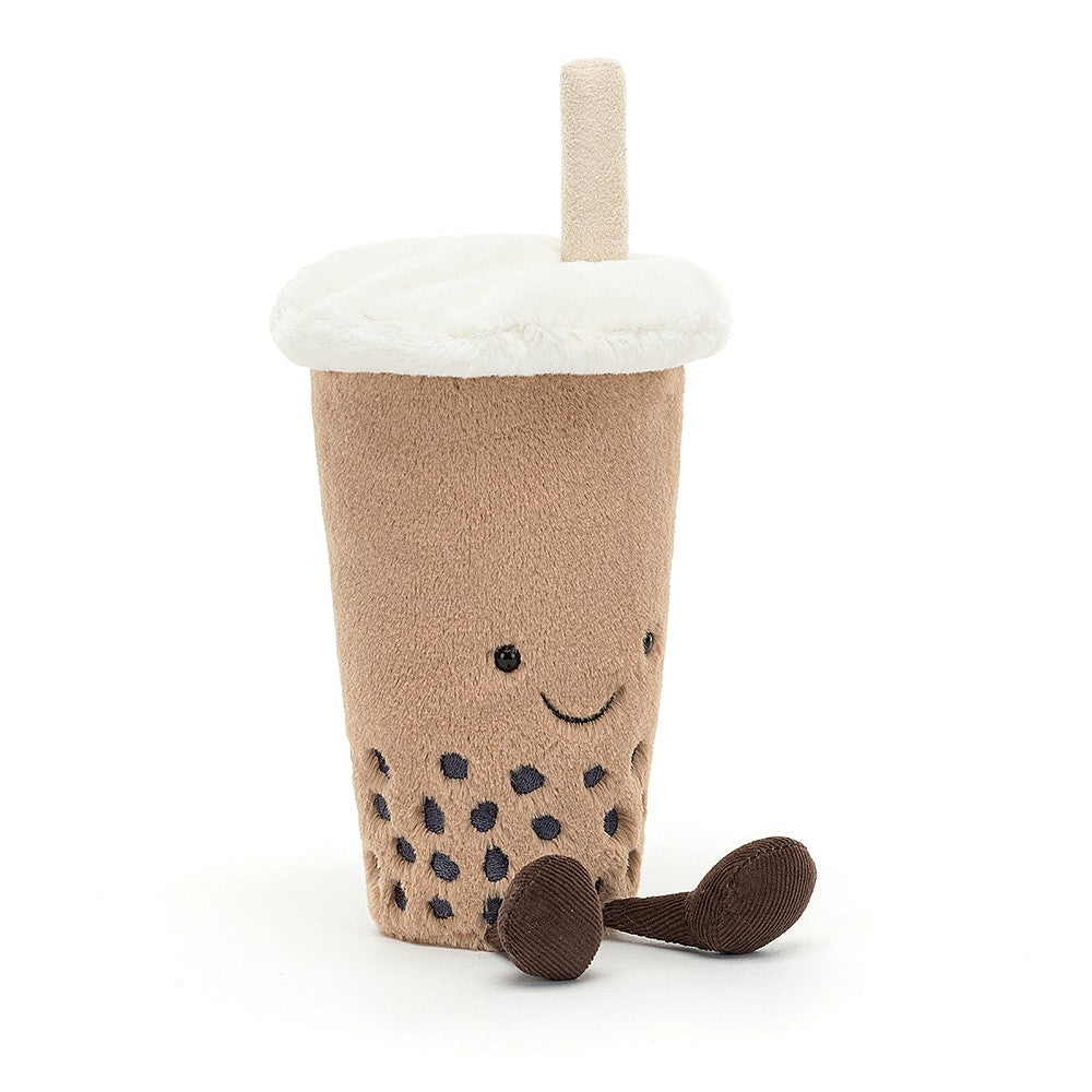 plush jellycat beige coffee cup with a smily face, brown legs, brown embroidered bubbles at the base with a fur cream lid and straw