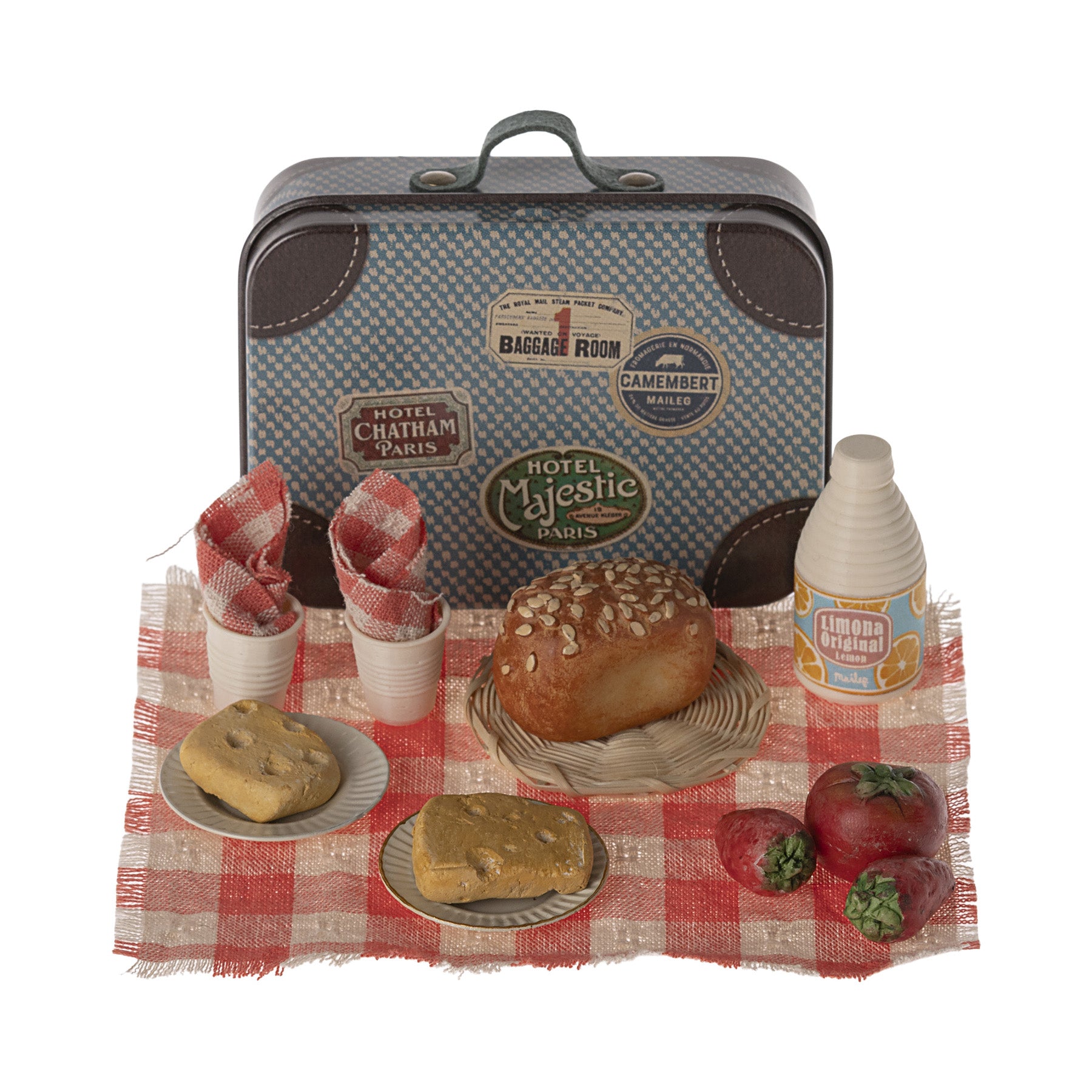 maileg picnic set with a table clothe and food set out on it
