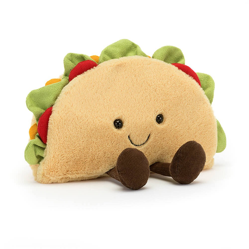Jellycat soft toy taco, with black bead eys, embroidered mouth, and brown booties