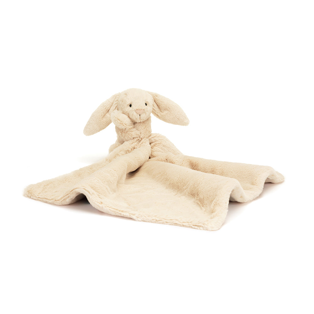 jellycat basfult lux bunny is sitting holding a blanket