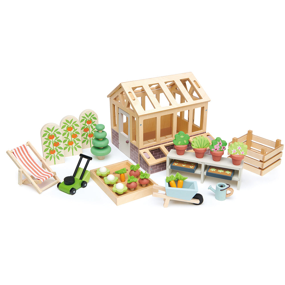 Tender Leaf Toys Greenhouse and Garden Set - A nature-inspired dollhouse extension featuring a classic plywood greenhouse, garden tools, vegetables, and accessories for gardening and relaxation.