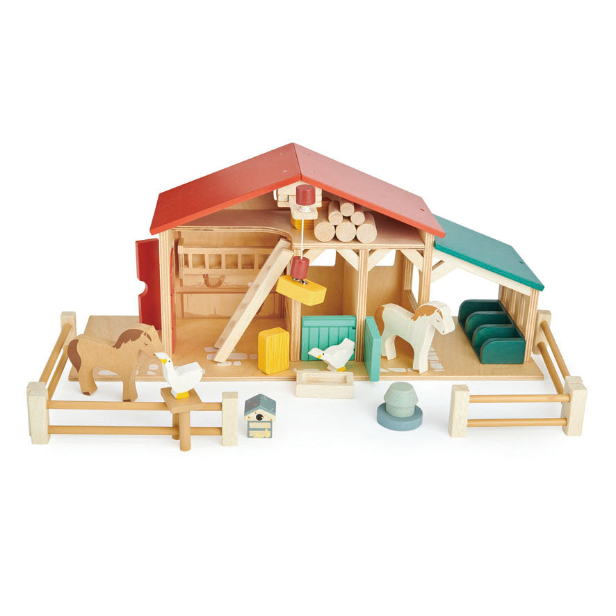 Tender Leaf Toys Farm - A wooden farm set with barns, stables, animals, and various accessories. Designed for easy play with a focus on accessibility for children's hands