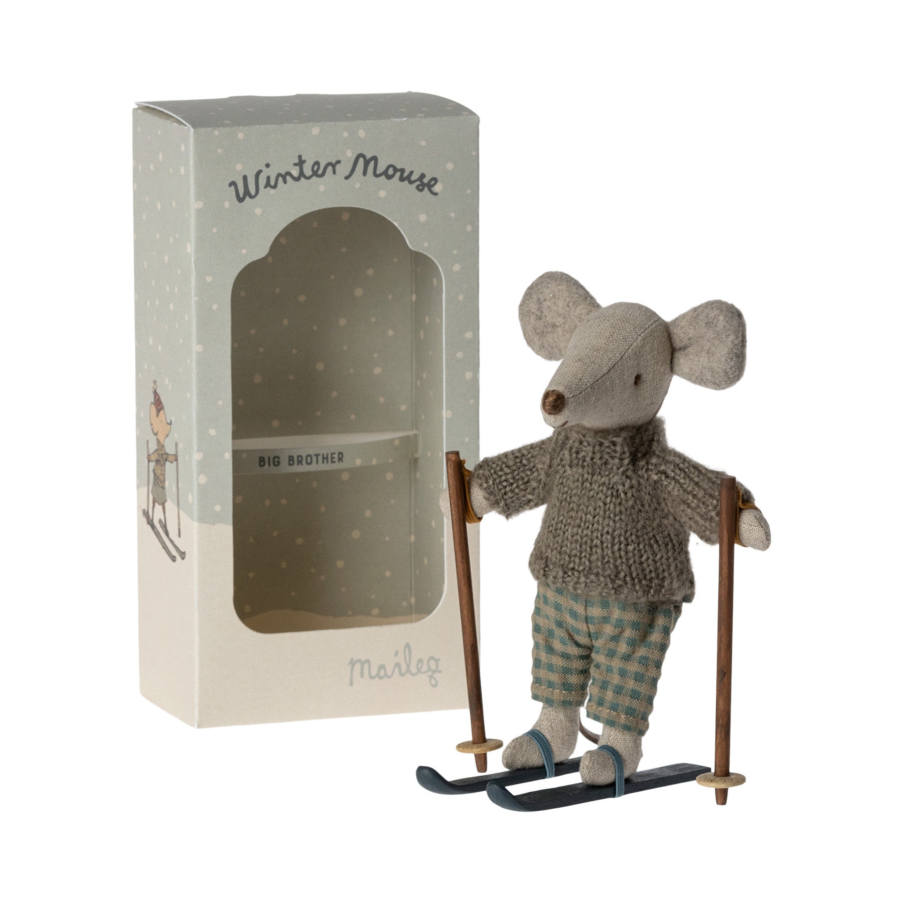 maileg mouse wearing a brown jumper, check trousers & skis, standing in front of the presnetation box