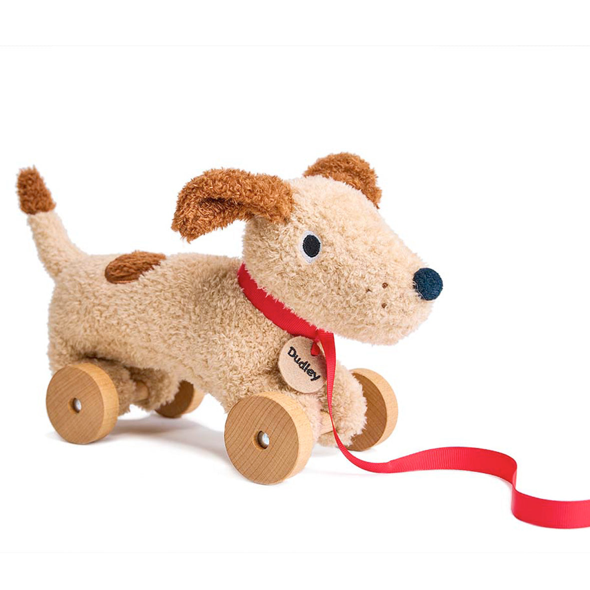 tender leaf toys pull along beige dudly dog with a red lead and collar and name tag