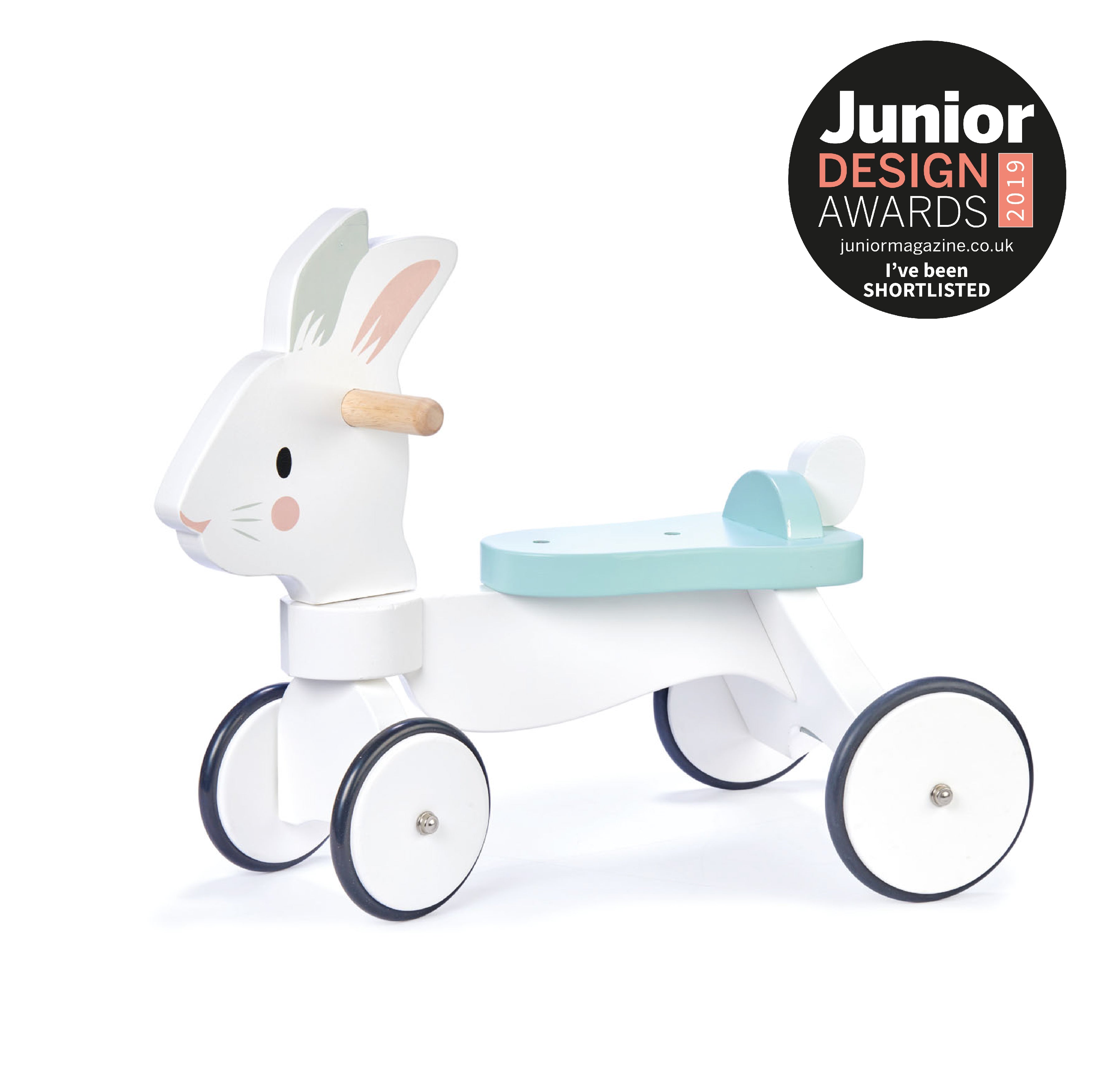 Explore the Tender Leaf Toys Running Rabbit Ride-On, a 2019 Junior Design Awards finalist. This sturdy, white bunny ride-on boasts non-slip rubber-trimmed wheels and is crafted from sustainably sourced rubberwood, rigorously tested for stability