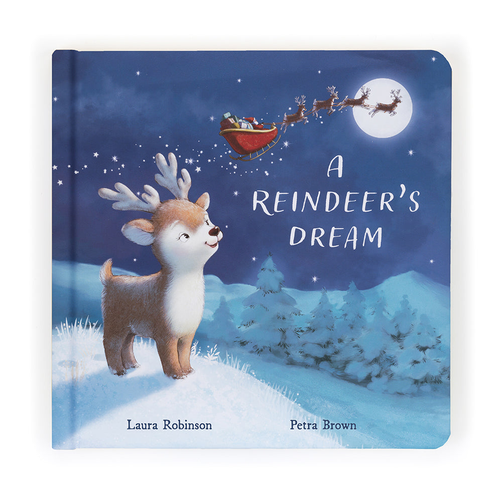 cover of a reindeer's dream book showing a cute reindeer looking up at the moon with santa riding across it.