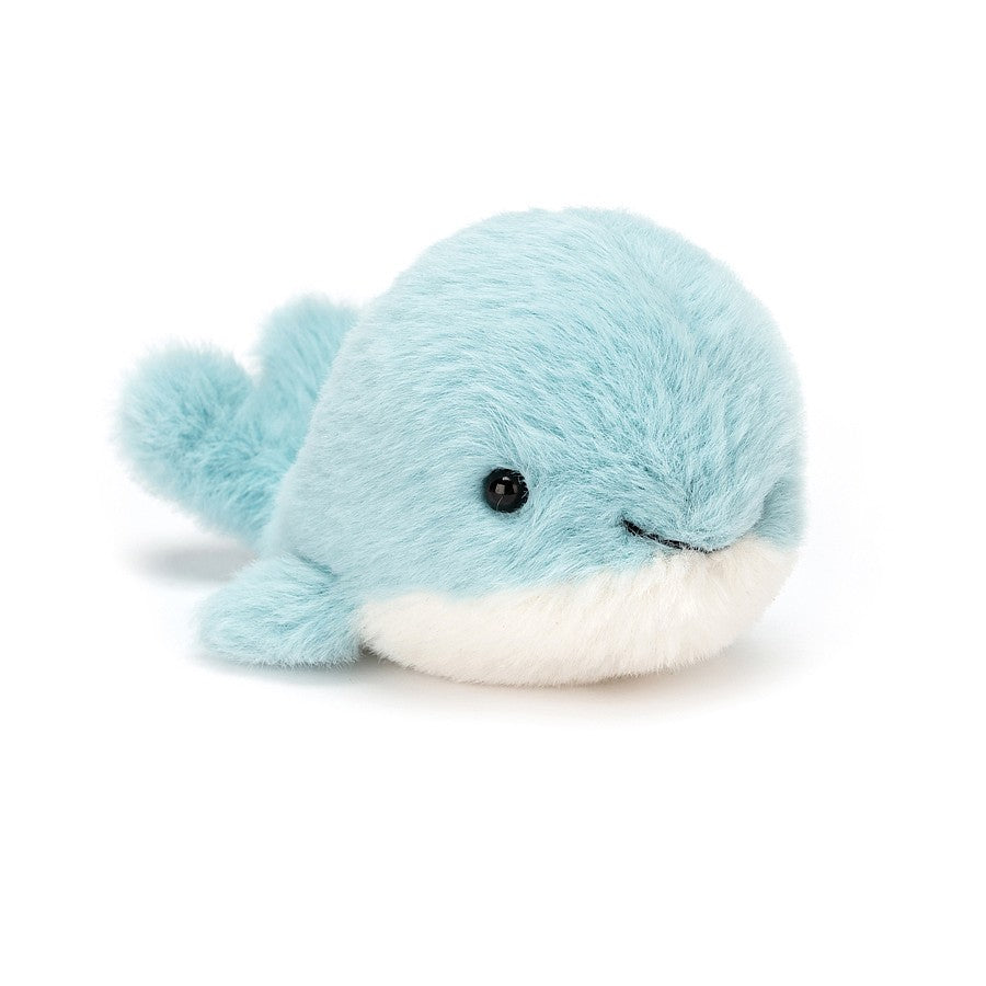 Fluffy Whale soft toy with a big stitchy smile and shiny black bead eyes.