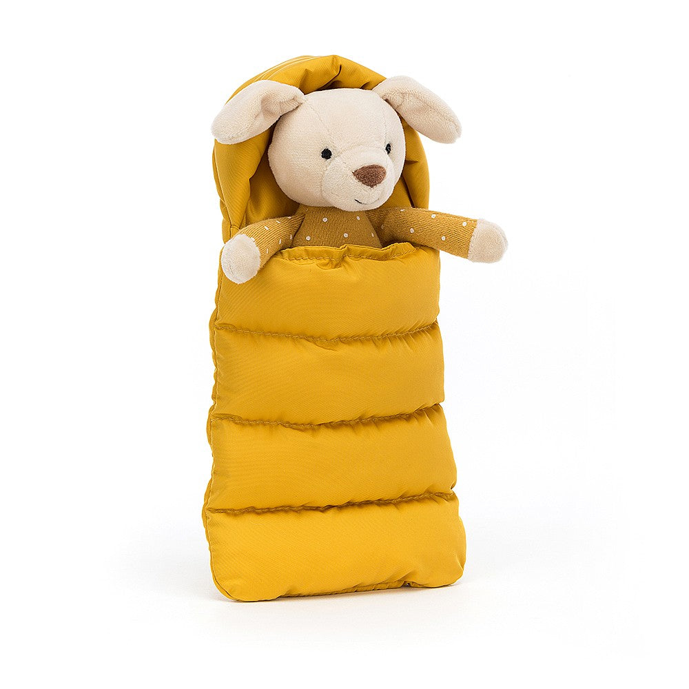 jellycat little cream pup with a yellow polka dot body tucked up in his yellow sleeping bag