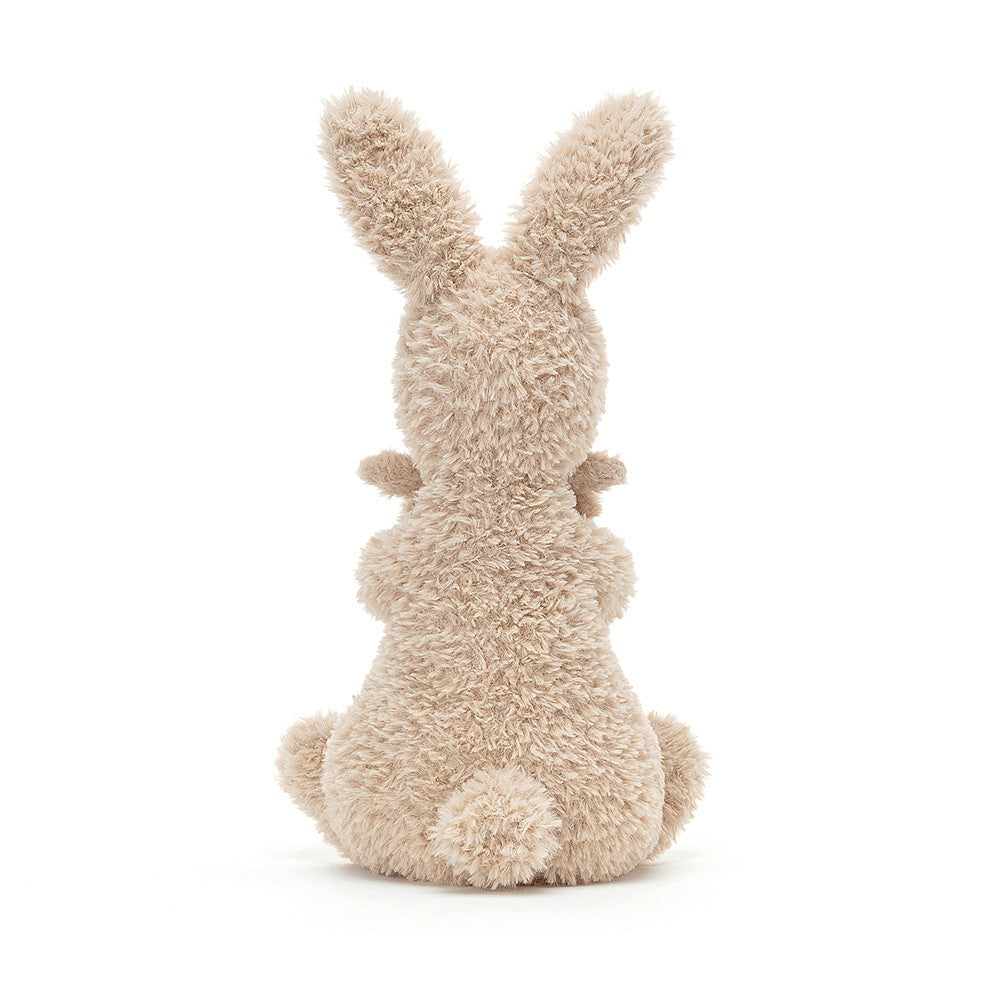 rear view of jellycat cream huddles bunny with pointy ears and fluffy tail