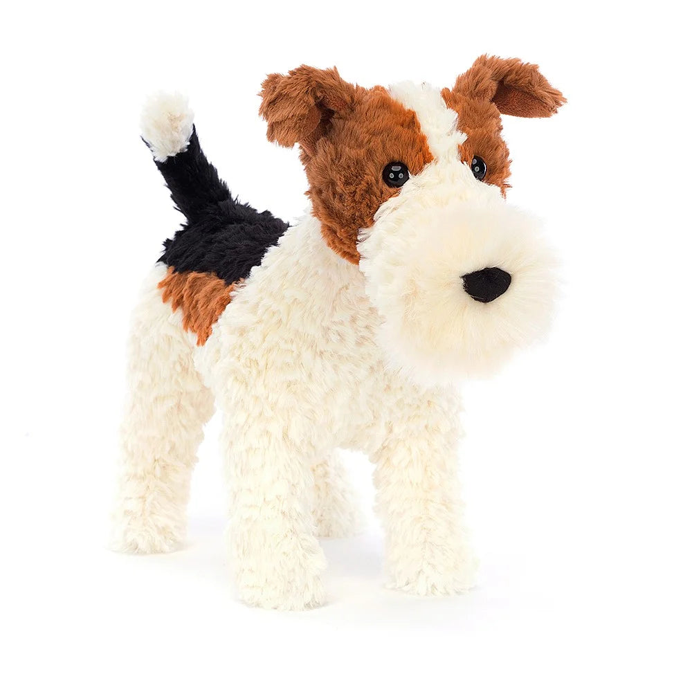 soft toy dog with white body and muzzle with brown and black patches by Jellycat
